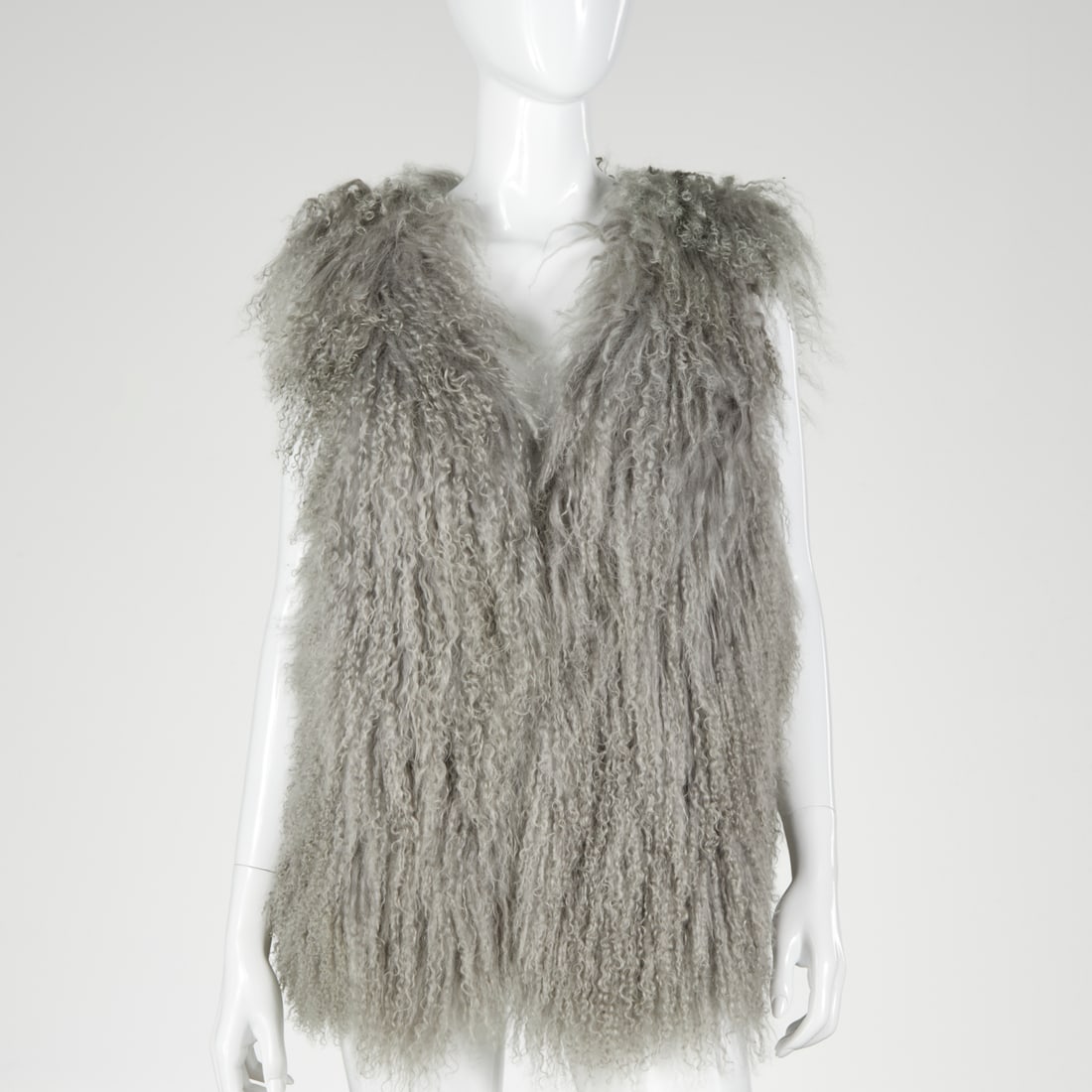 Pink Tartan Mongolian lamb fur vest: Pink Tartan Mongolian lamb fur vest, 21st c., pale gray fur, fully lined in PT logo fabric, size L, 40"b, 27"l, original retail $1598 Provenance: From the Personal Collection of a Saks Fifth Avenue Re