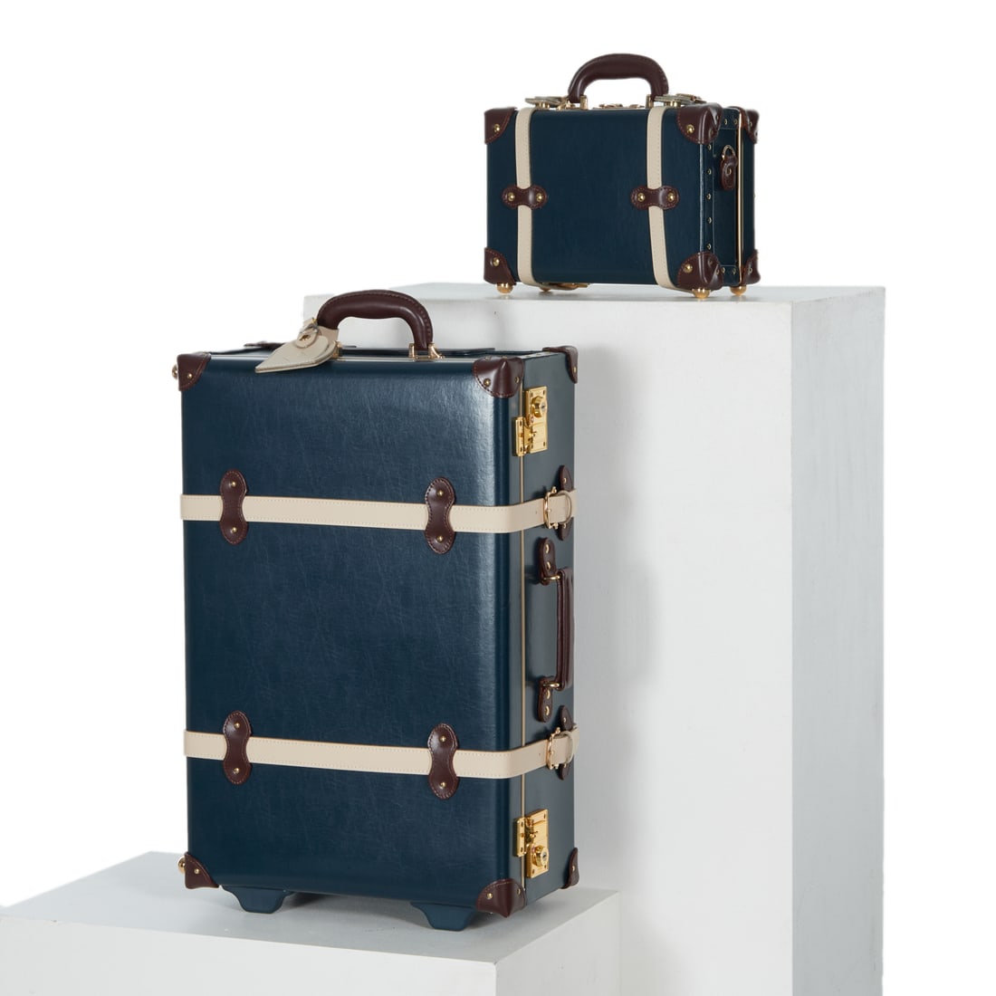Group of hardcase Steamline "Architect" luggage: Group of hardcase Steamline "Architect" luggage, 21st c., both in navy with print lining, TSA approved locks, (1) Architect stowaway, with zippered lid compartments, sleeper bag, approx. 24" x 14.5" x