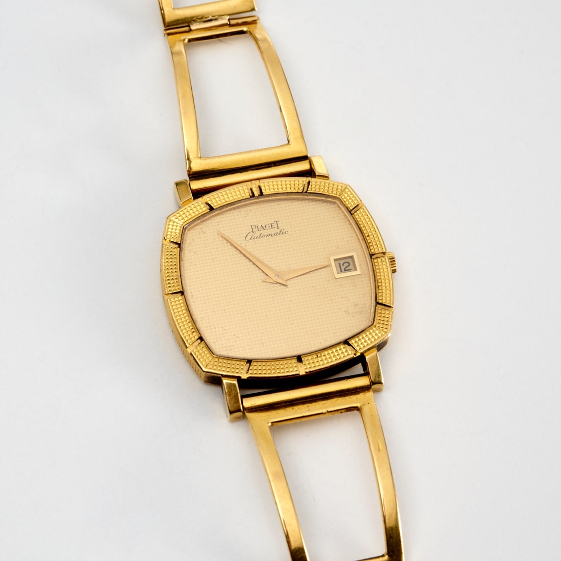 Piaget Automatic Tonneau Hobnail 18k watch: Piaget Automatic Tonneau Hobnail 18k watch, c. 1970s, marked 13427, 156150 with open link (poss. not original) band, powered by the famous 22K gold micro rotor leveraging 12P1 ultra-thin automatic mov