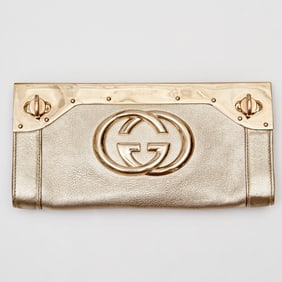 Gucci Gold metallic G Britt clutch