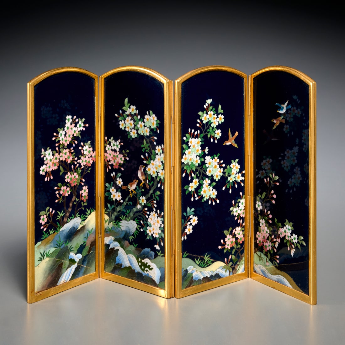 Inaba Japanese cloisonne tabletop screen: Inaba Japanese cloisonne tabletop screen, 20th c., four hinged panels, decorated with birds on flowering branches to front, in goldtone metal frame, silvertone metal to back panels in bamboo design,