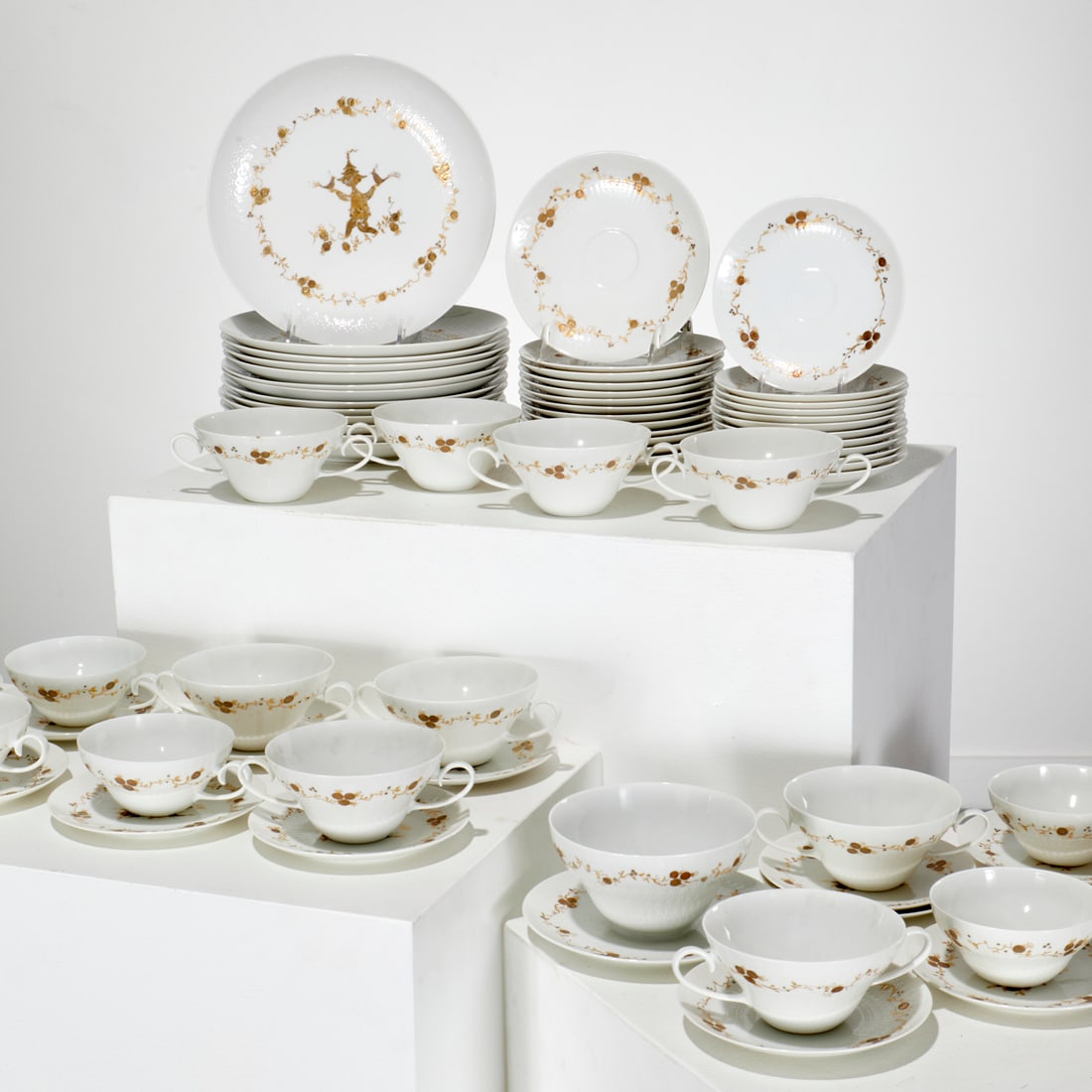 Bjorn Wiinblad for Rosenthal, table service: Bjorn Wiinblad for Rosenthal, table service, 20th c., Germany, (74) pieces, incl. (13) dinner plates, 9.75"dia, (13) bread and butter plates, 5.75"dia, (9) cream soup cups, 2.5"h x 6.5"w x 4.75"d, (13