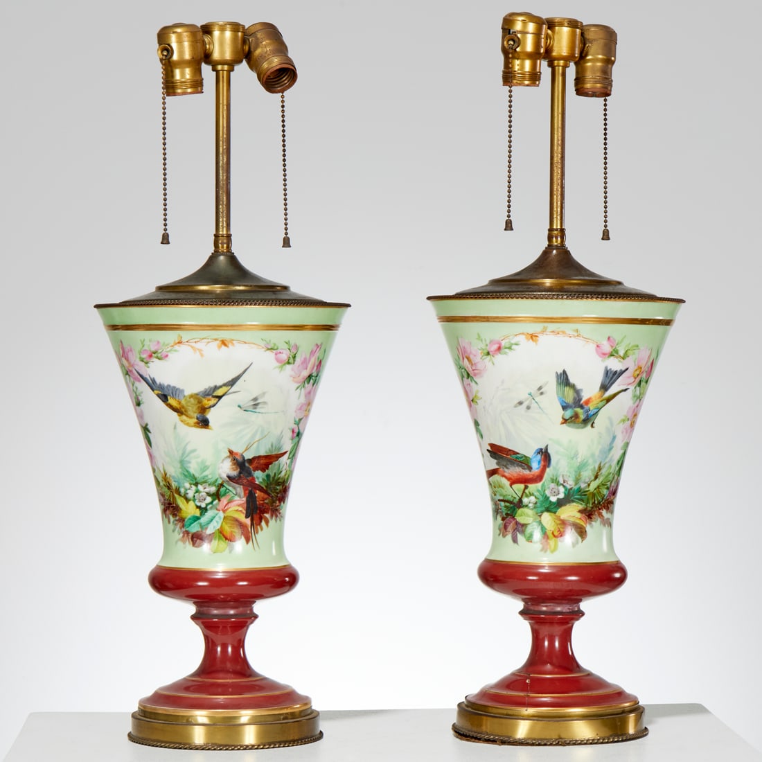 Pair Victorian porcelain ornithological urn lamps: Pair Victorian porcelain ornithological urn lamps, 19th/20th c., pair pedestal vases, decorated with birds in floral surrounds, mounted as table lamps, unsigned, larger: 23.5"h x 8.5"dia (total) Prove
