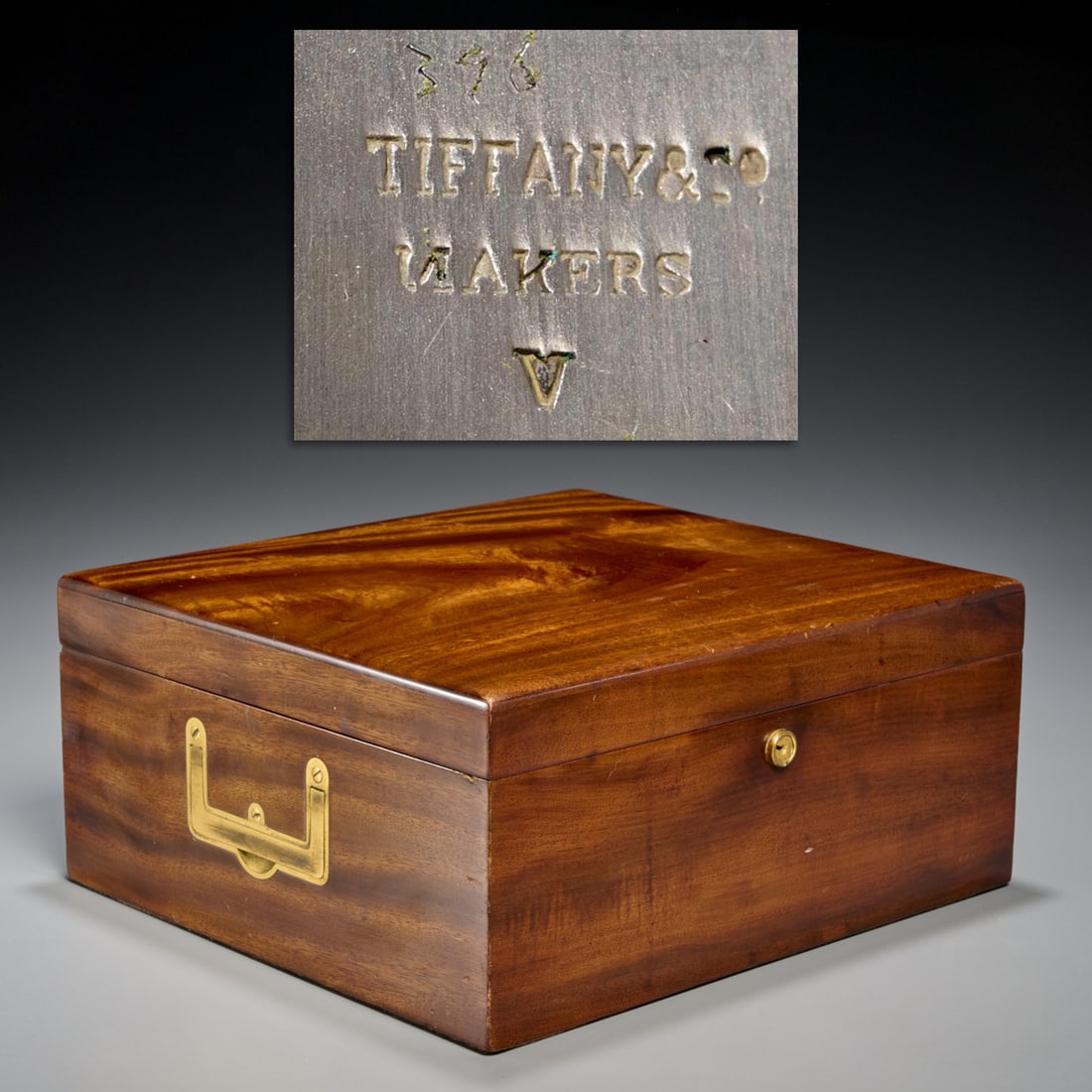 Tiffany & Co, mahogany humidor: Tiffany & Co, mahogany humidor, 20th c., New York, square box, hinged lid reveals interior compartments, marked to liner and box, inset handles, 5.5"h x 12.5"w x 11.25"d Provenance: A Private Collecti