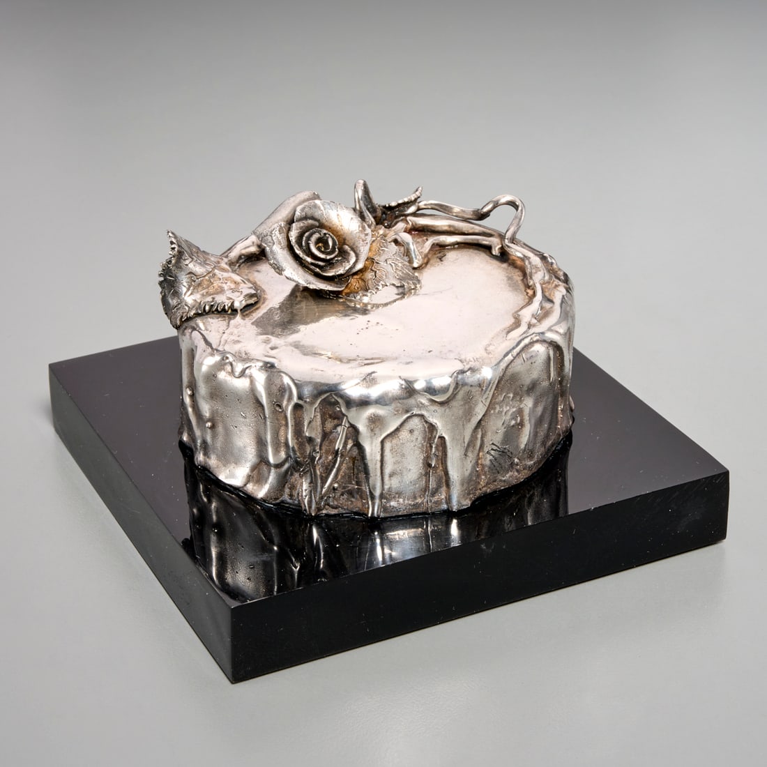 Pat Lasch, sterling silver sculpture, 1987: Pat Lasch, sterling silver sculpture, 1987, Pat Lasch (American, b. 1944), Untitled (Silver Cake), sterling silver cake, signed "Lasch" along side of cake, mounted on black acrylic base, signed "P. La
