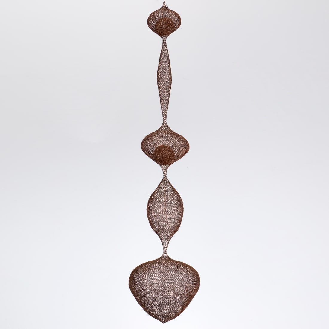 Ruth Asawa (manner), hanging wire sculpture: Ruth Asawa (manner), hanging wire sculpture, In the manner of Ruth Asawa (Japanese-American, 1926-2013), organic form, with signed tag interior, possibly reading "Fider", 57"h x 12"dia