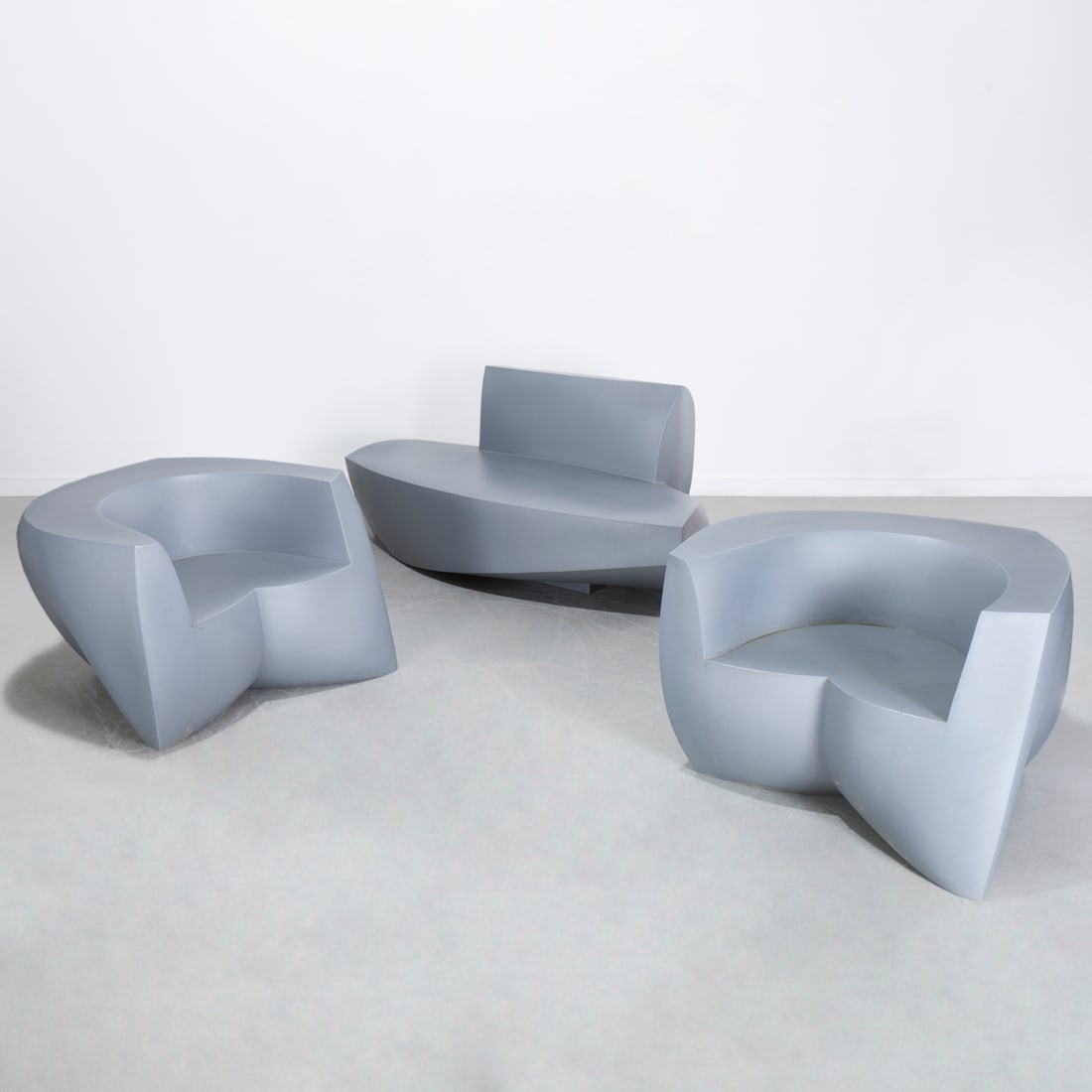 Frank Gehry for Heller seating group: Frank Gehry for Heller seating group, 20th c., gunmetal gray, incl. (2) easy chairs, (1) sofa, each marked underside, 25"h x 36"w x 29"d (chairs), 29"h x 69"w x 35"d