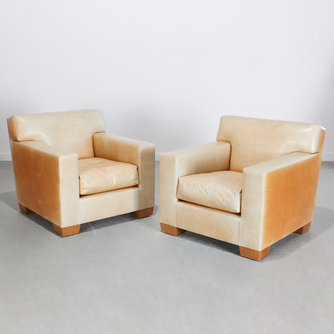 J.M. Frank style, pair club chairs, Peter Marino: J.M. Frank style, pair club chairs, Peter Marino, 21st c., designed by Peter Marino, fine caramel leather upholstery on block feet, each 32"h x 33"w x 35"d Provenance: A Peter Marino Private Commissio