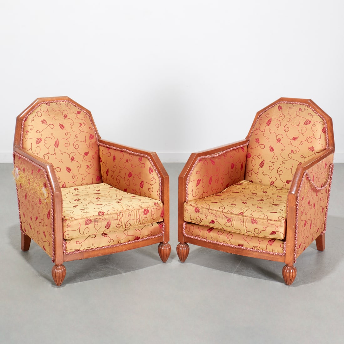 Sue et Mare (style), pair upholstered bergeres: Sue et Mare (style), pair upholstered bergeres, First half 20th c., France, angular frames with gold vine pattern silk upholstery reeded ball feet, unmarked, each 33.5"h x 26.25"w x 28.25"d Provenance