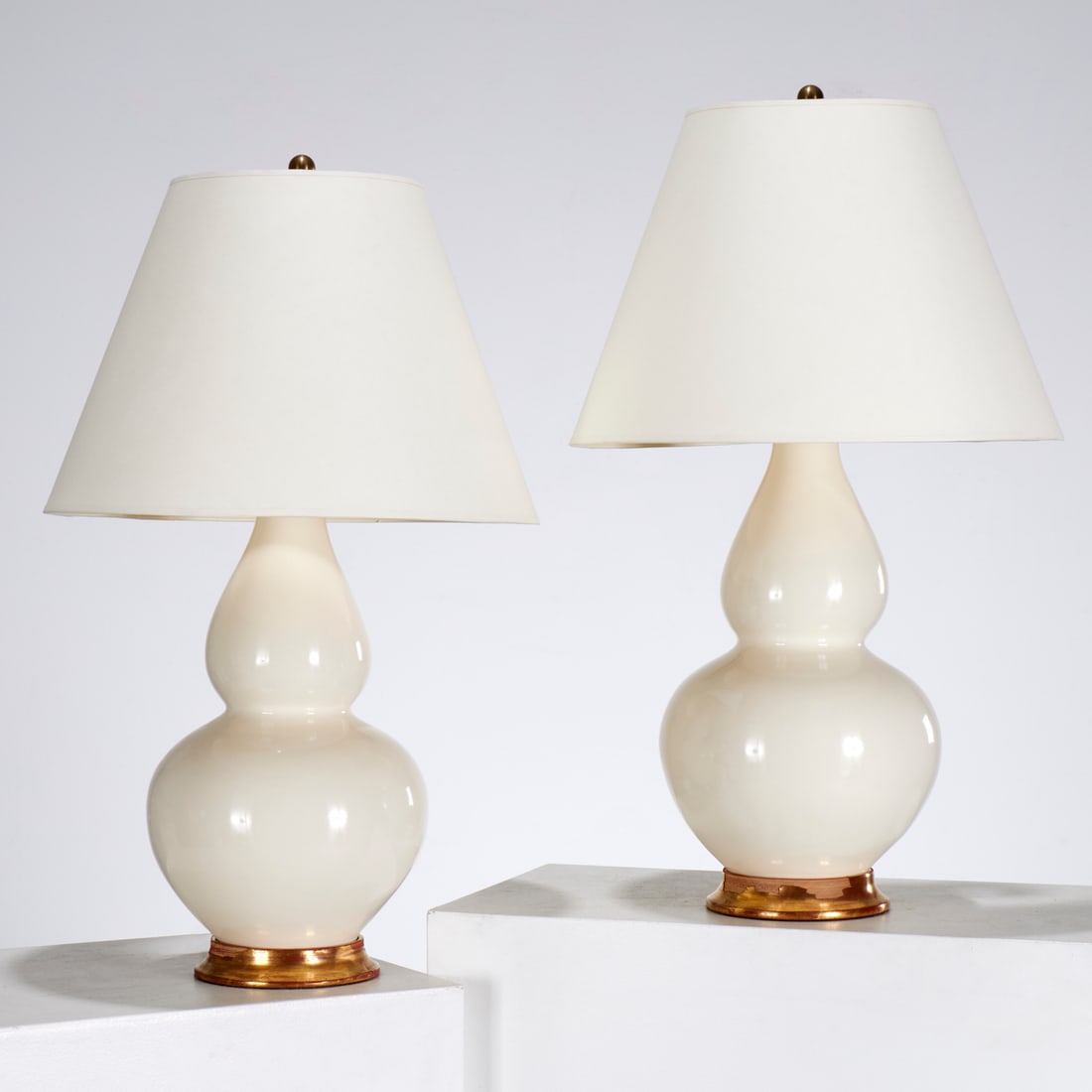Christopher Spitzmiller, pair "Aurora" lamps: Christopher Spitzmiller, pair "Aurora" lamps, c. 2009, USA, monochrome white double gourd body with giltwood base, signed and dated underside, 30"h x 10"dia (lamp only) Provenance: A Private Collectio