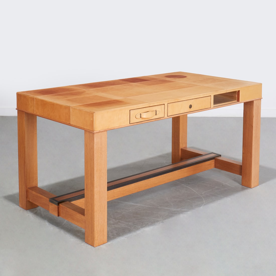 Paul-Dupre Lafon style, writing desk, Peter Marino: Paul-Dupre Lafon style, writing desk, Peter Marino, 21st c., designed by Peter Marino, cerused oak with three leather faced drawers and pulls, bronze mounted stretcher, unmarked, 30"h x 60"w x 32"d Pr