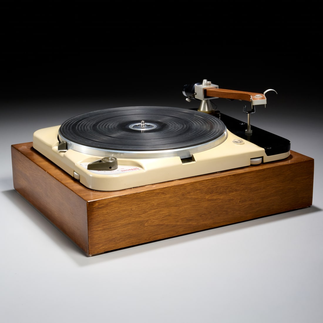 Vintage Thorens TD-124 turntable: Vintage Thorens TD-124 turntable, c. 1960s, Switzerland, serial number 24385, with teak tonearm, 7.5"h x 17.25"w x 14.25"d