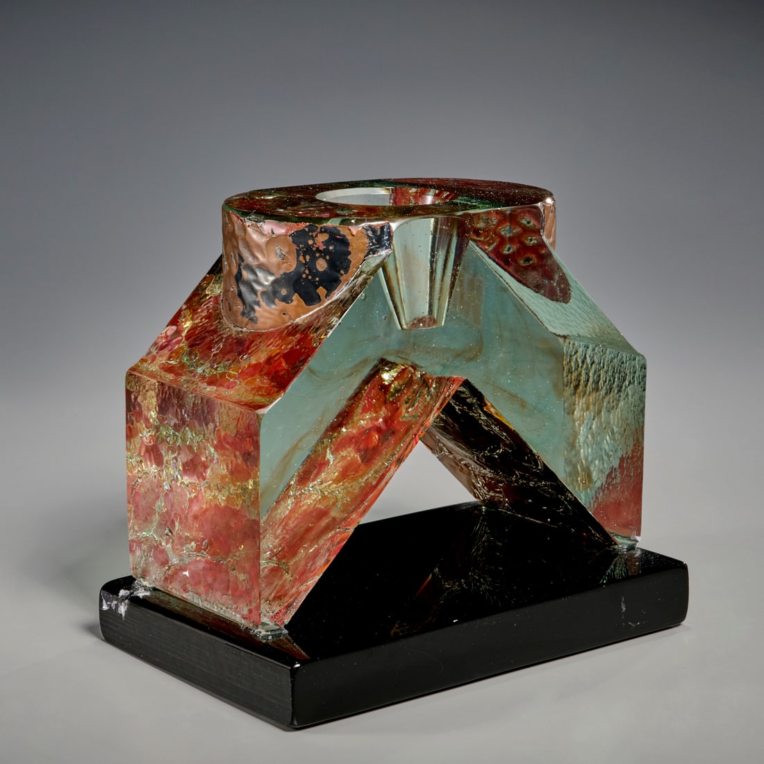 John Conard Lewis, studio glass vessel: John Conard Lewis, studio glass vessel, John Conard Lewis (American, b. 1942), geometric form glass bowl with copper leaf decoration, on black glass base, signed and inscribed "91-65" lower edge, 8.5"