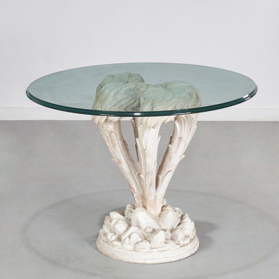 Serge Roche (manner), center table: Serge Roche (manner), center table, c. 1960/70s, manufactured by Edward Krumpe or Sirmos, round glass top on palm frond supports and circular rockwork base, unmarked, 28.5"h x 38"dia Provenance: A