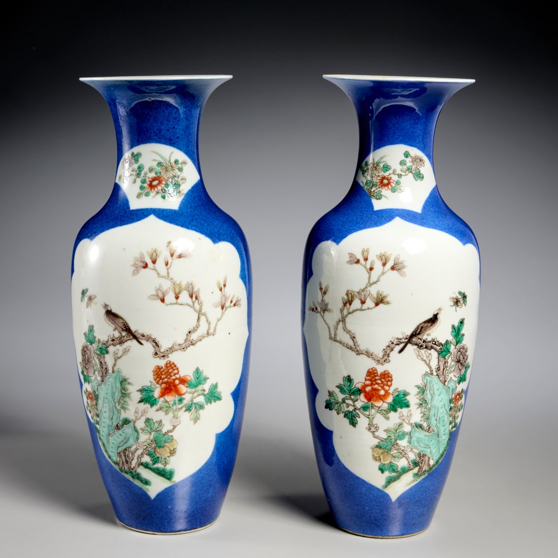 Pair Chinese powder blue porcelain vases: Pair Chinese powder blue porcelain vases, Qing Dynasty (19th c.), China, decorated with bird and tree peony reserves, underglaze blue four-character Kangxi mark to underside, each 14.25"h x 5.5"dia