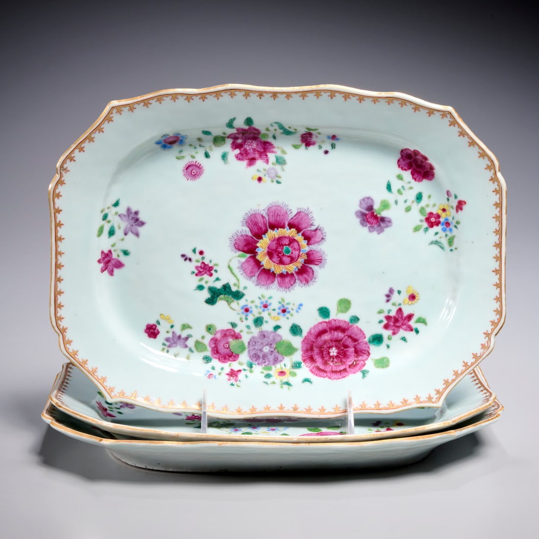(3) Chinese Export Qianlong famille rose dishes: (3) Chinese Export Qianlong famille rose dishes, c. 1750-1760, shaped rectangular form, with polychrome decorated flowers, 12"l x 9"w (slightly larger example), 11.5"l x 8.5"w (two slightly smaller di