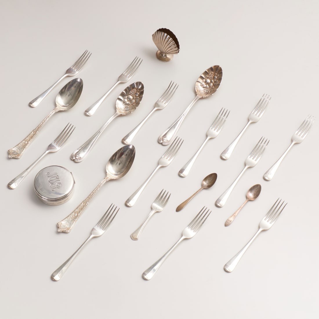 Tiffany & Co., sterling silver tableware group: Tiffany & Co., sterling silver tableware group, 20th c., (21) pieces, each marked "Tiffany & Co.", incl. (12) luncheon forks, "C" monogram, 6.75"l; (4) serving spoons--2 monogrammed, 2 with embossed
