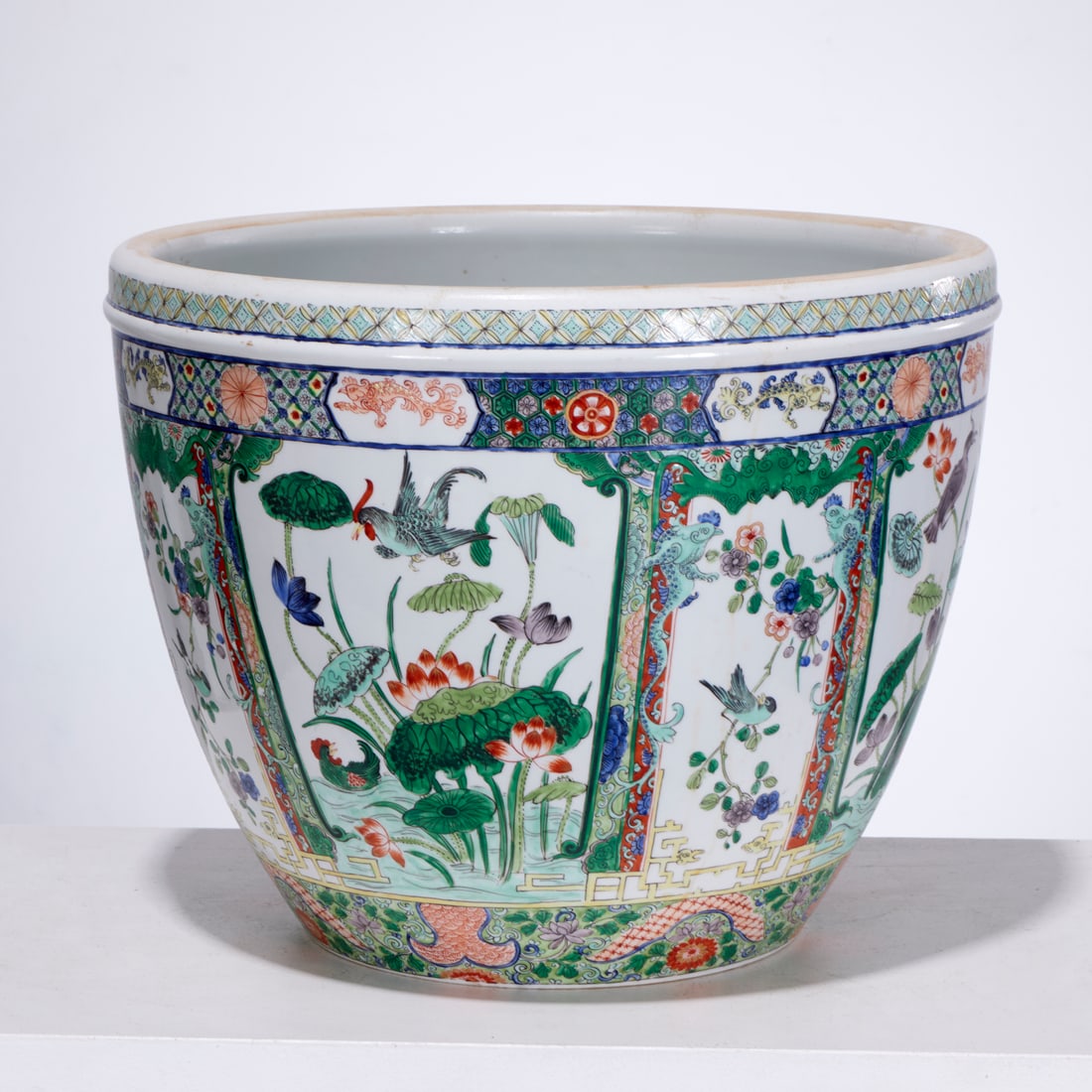 Chinese famille verte porcelain jardiniere: Chinese famille verte porcelain jardiniere, Late Qing Dynasty (19th/20th c.), decorated with panels of birds and flowers, unmarked, 12"h x 15"dia Provenance: A Private Collection: 1095 Park Avenue,