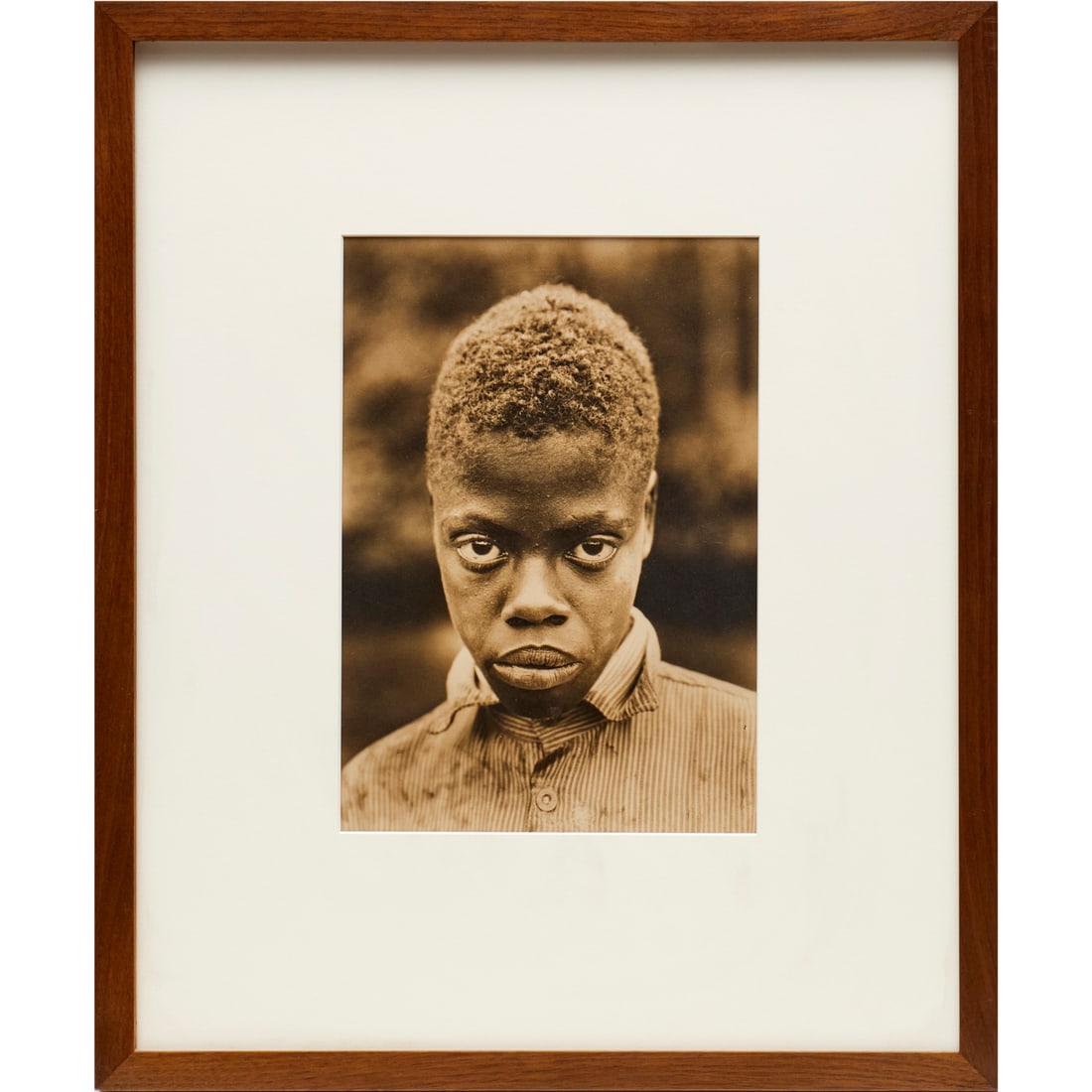 Margaret Bourke-White, signed gelatin silver print: Margaret Bourke-White, signed gelatin silver print, Margaret Bourke-White (American, 1904-1971), Portrait of a Black Boy, signed lower right mat, artist stamp verso mat, incl. scan of original Christi