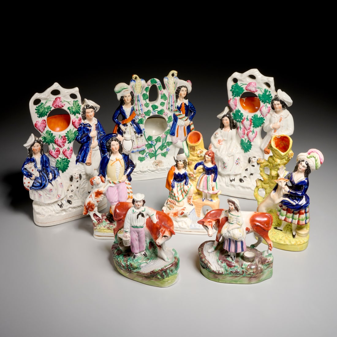Collection Staffordshire pottery figures: Collection Staffordshire pottery figures, 19th/20th c., England, (8) pieces, incl. pocket watch holders, spill vases, and figural groups, 12.5"h x 8"w x 2"d (largest), 7"h x 5.5"w x 3"d (smallest) Pro