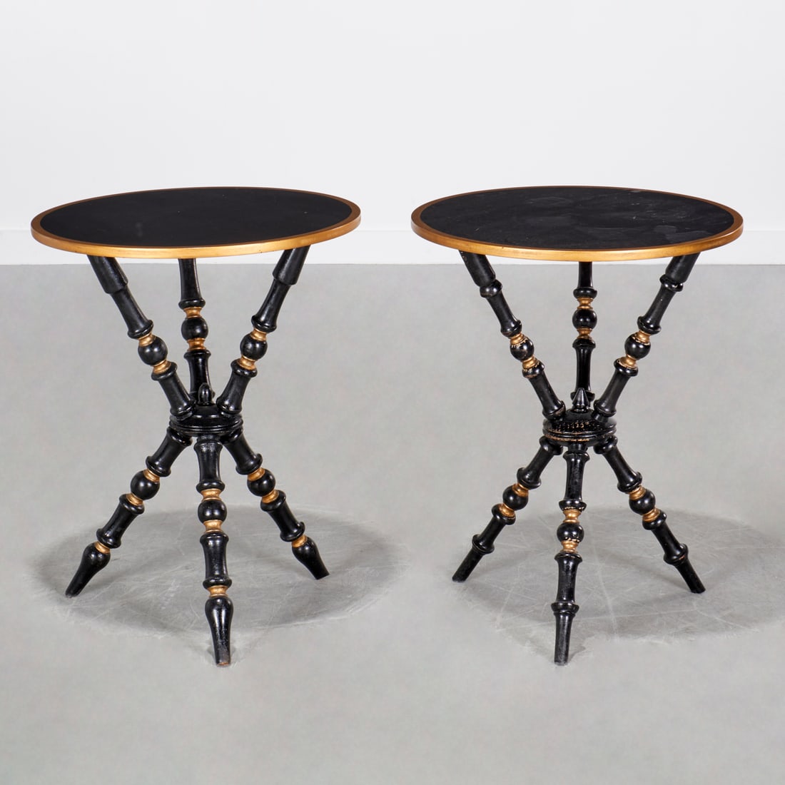 Pair Aesthetic Movement style "Gypsy" tables: Pair Aesthetic Movement style "Gypsy" tables, 20th c., black painted and parcel gilt, round top on bobbin turned tripod base, unmarked, each 25.25"h x 20"dia Provenance: A Private Collection: Rumson,