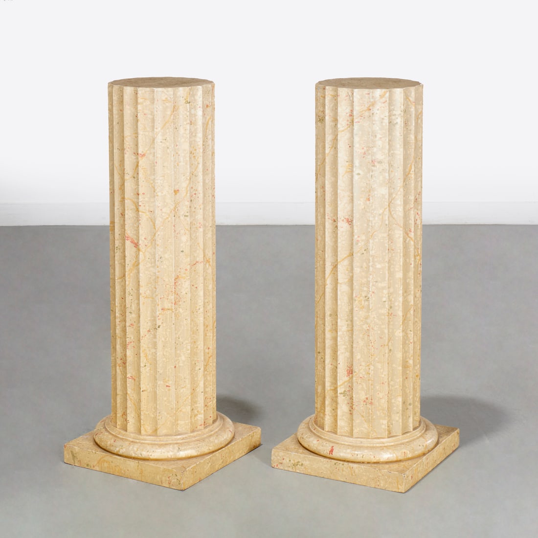 Pair custom Faux Marbre painted wood pedestals: Pair custom Faux Marbre painted wood pedestals, Mid 20th c., of fluted columnar form on stepped base, 35.5"h x 9.75"dia (top), 13.25"sq (base) Provenance: A Private Collection: 1095 Park Avenue, NYC