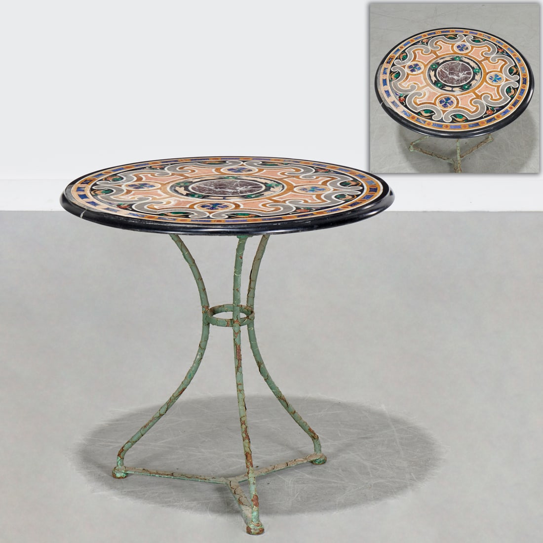 Italian pietra dura side table: Italian pietra dura side table, 20th c., circular top with rosette and scroll designs, raised on verdigris tripod base, unmarked, 22.25"h x 23.25"dia