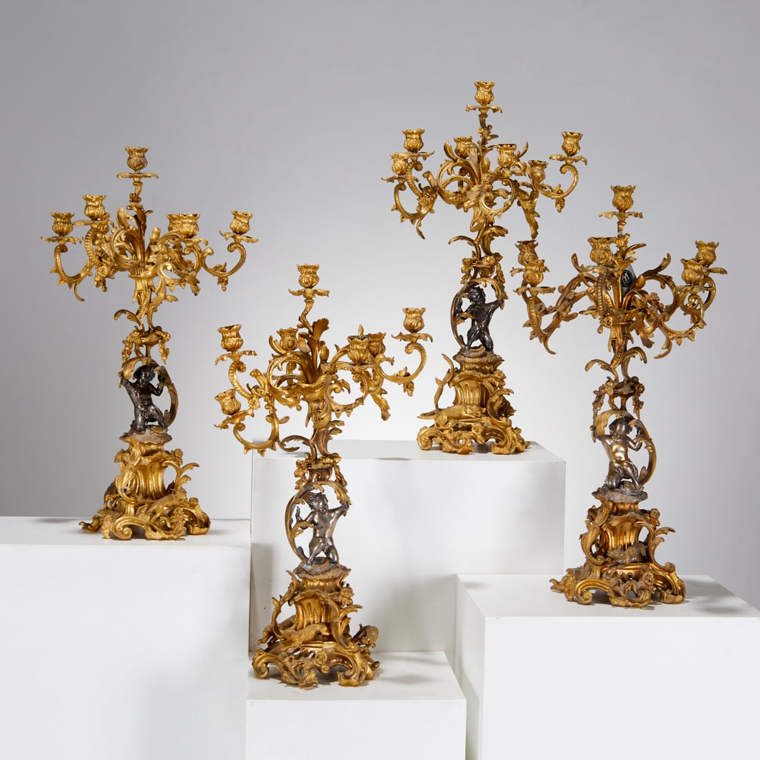 Set (4) Napoleon III gilt bronze candelabra: Set (4) Napoleon III gilt bronze candelabra, Third quarter 19th c., France, seven foliate scroll candle arms supported by silvered-bronze kneeling putto, raised on base with hound chasing hare, unmark