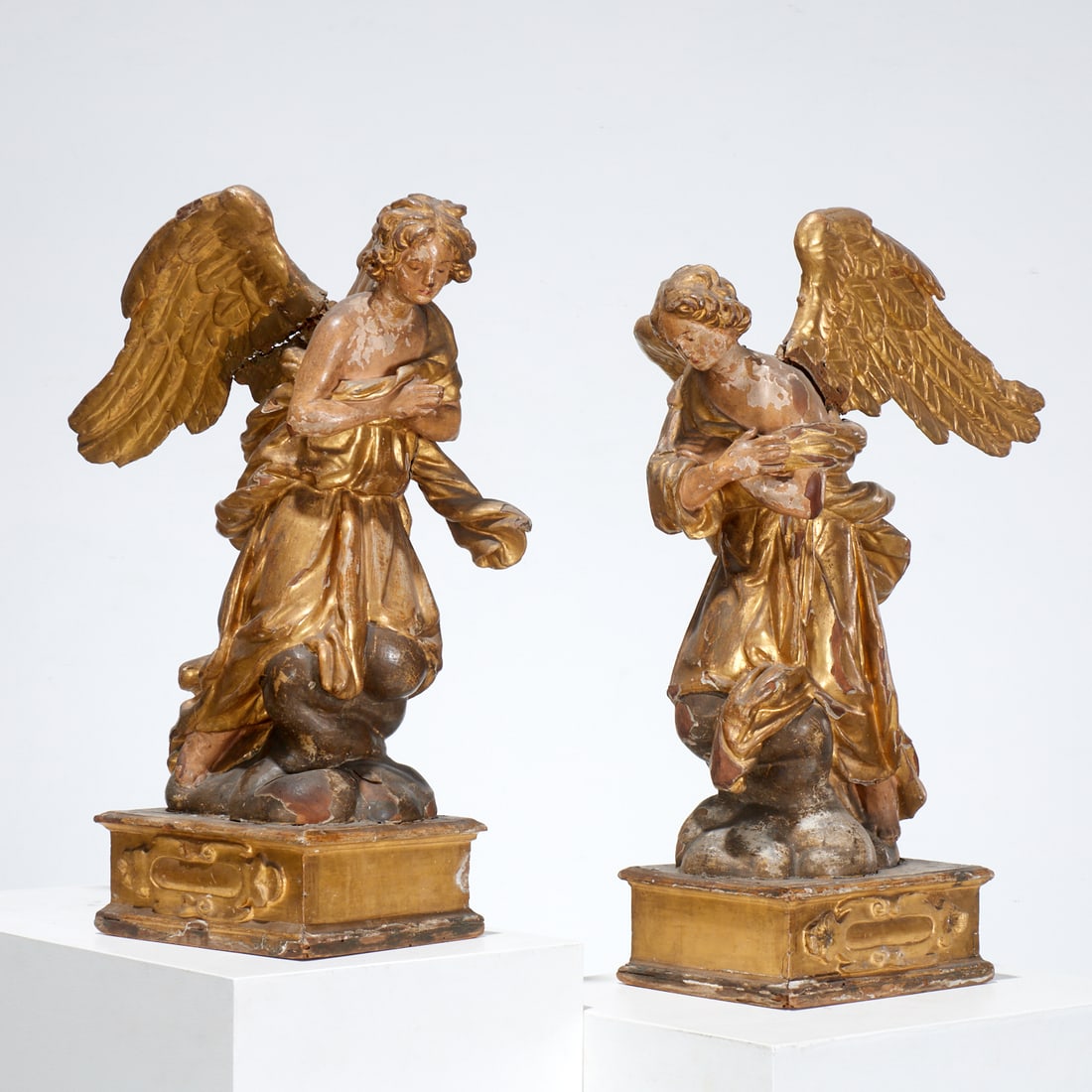 Pair large Continental Baroque giltwood angels: Pair large Continental Baroque giltwood angels, 18th/19th c., Italian or Spanish, gilt and polychrome decorated, modeled in poses of prayer and solace, incl. Parish-Hadley tag, approx. 27.5"h x 12"w