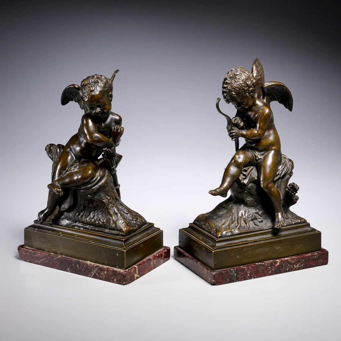 Charles-Gabriel Lemire (after), (2) bronze cherubs: Charles-Gabriel Lemire (after), (2) bronze cherubs, After Charles-Gabriel Lemire (French, 1741-1827), cherubs with bow and arrow on stone bases, bronze with brown patina, signed in cast to base, each