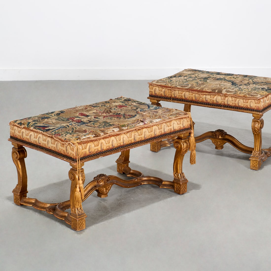 Pair Louis XIV style giltwood Aubusson tabourets: Pair Louis XIV style giltwood Aubusson tabourets, 19th/20th c., rectangular antique tapestry seats, on scrolled legs joined by serpentine stretcher, each 16"h x 18.5"w x 27.5"d Provenance: Property