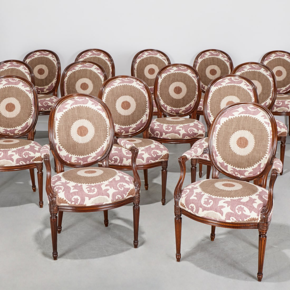 Set (14) Donghia Louis XVI style chairs: Set (14) Donghia Louis XVI style chairs, 20th c., (2) armchairs, (12) side chairs, channeled frame, exposed oval back, serpentine seat, raised on fluted and tapering legs, Susani style upholstery,