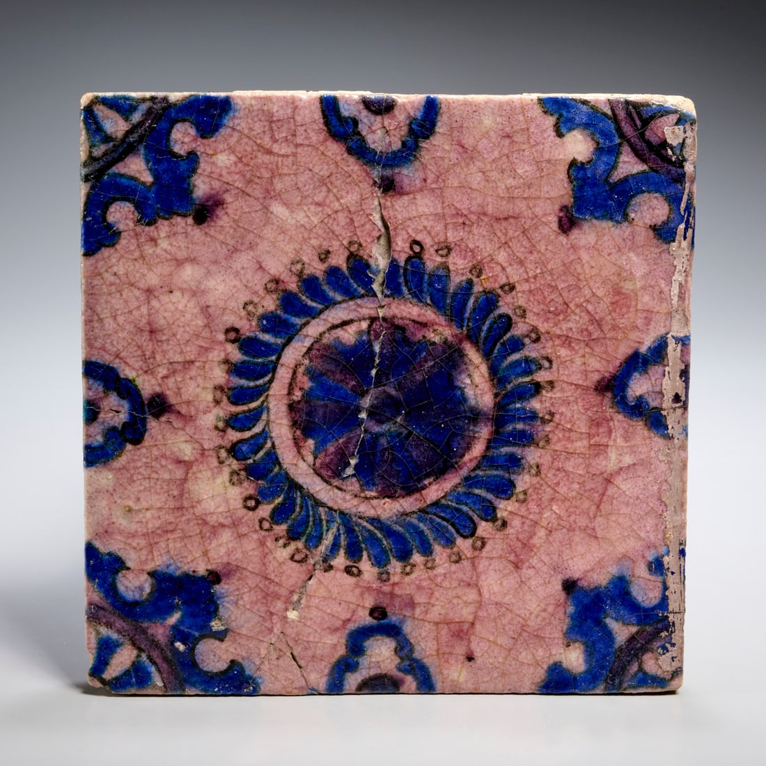 Safavid glazed earthenware tile, ex museum: Safavid glazed earthenware tile, ex museum, 17th c., Iran, blue glaze in organic pattern, inventory number inscribed underside, 7.5"squ x 0.75"d Provenance: Works Deaccessioned to Benefit The Toledo M
