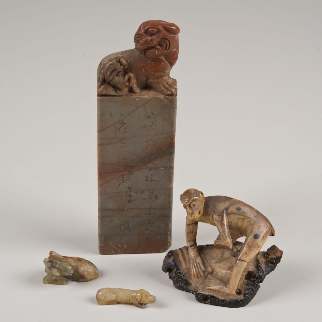 (4) Chinese carved soapstone animals and seal: (4) Chinese carved soapstone animals and seal: 19th c., monkey, ram, seal, and dog, largest: 7"h x 2"w (seal), smallest: 1.75"l (dog)