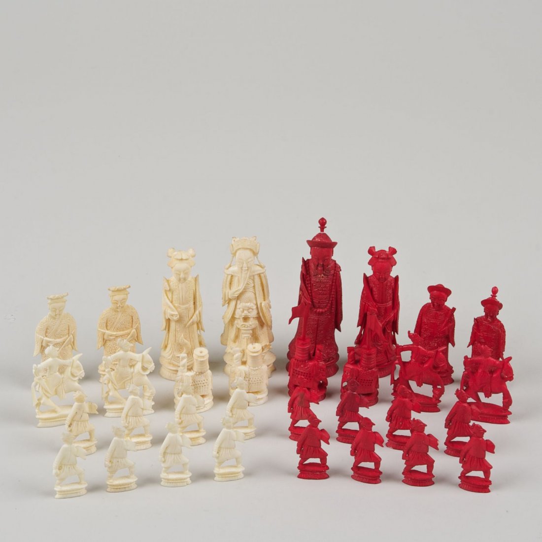 Chinese Export carved and stained ivory chess set: Chinese Export carved and stained ivory chess set: 19th/20th c., (32) pieces, largest: 4"h, smallest: 1.75"h