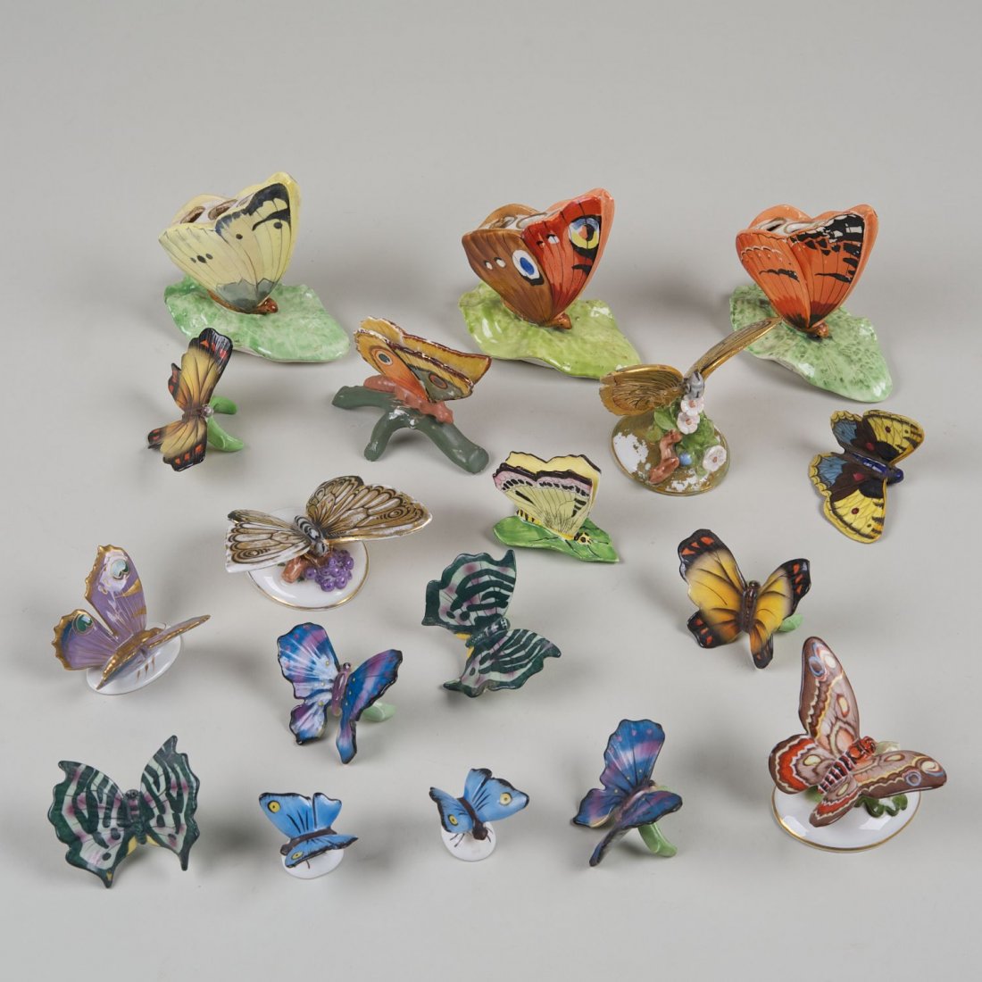 Collection (18) porcelain butterfly table ornaments: Collection (18) porcelain butterfly table ornaments: 19th/20th c., incl. flower holders, napkin rings and card holders, 4"h x 4"l (largest), 1.25"h x 1.5"l (smallest)