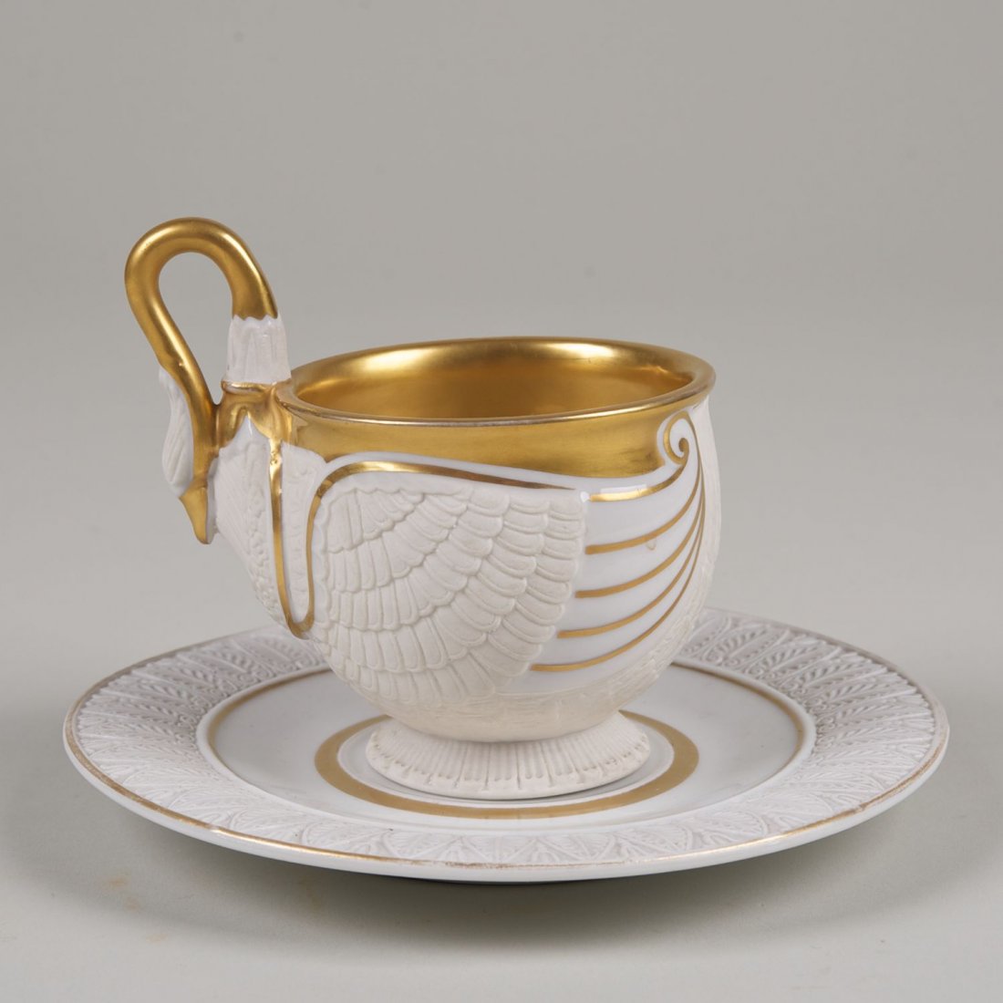 KPM porcelain swan cup and saucer: KPM porcelain swan cup and saucer: 20th c., 4.5"h x 6.5"dia. (total)