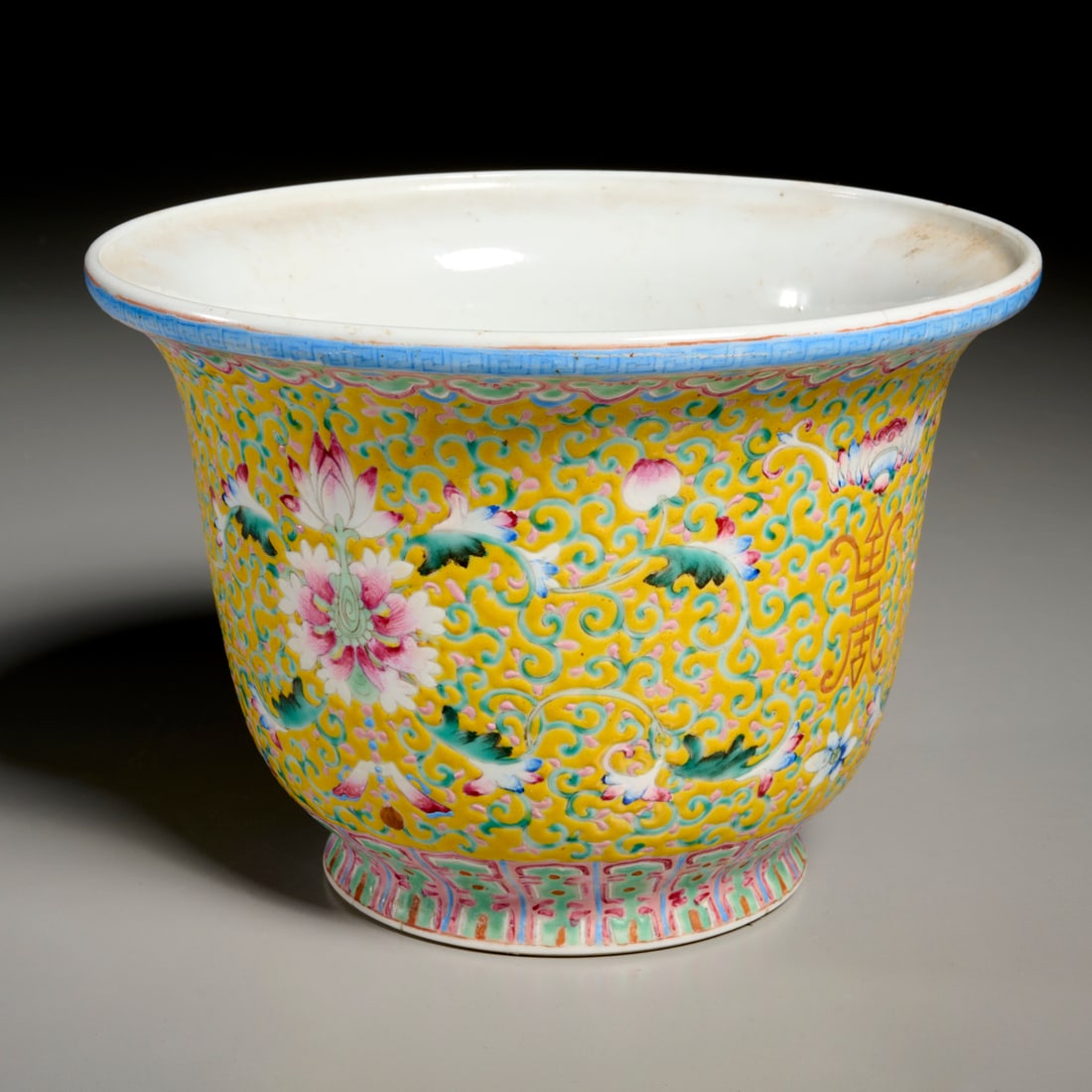 Chinese famille jaune porcelain jardiniere: Chinese famille jaune porcelain jardiniere, Late Qing Dynasty (19th/20th c.), flower and vine decoration, over-glaze red Qianlong mark to underside, 6"h x 8.5"dia
