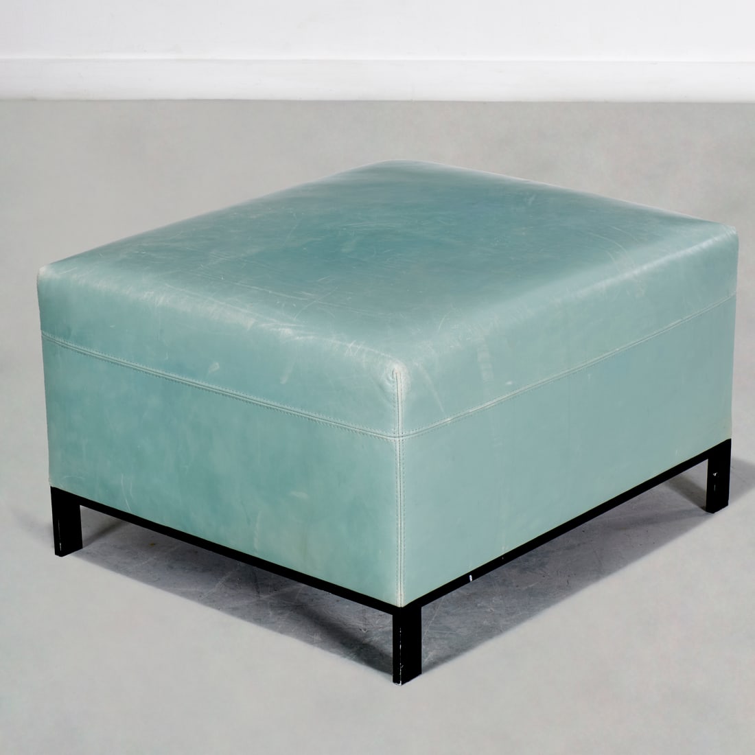 Christian Liaigre for Holly Hunt leather ottoman: Christian Liaigre for Holly Hunt leather ottoman, Late 20th/21st c., USA, light teal leather upholstered, marked underside, 16"h x 27"w x 23"d