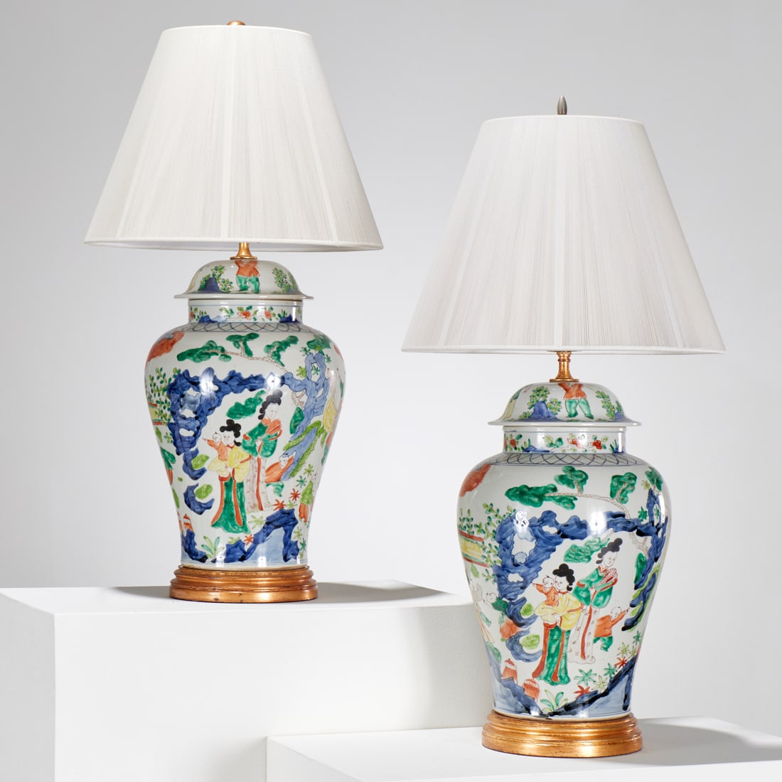 Pair Chinese Wucai porcelain ginger jar lamps: Pair Chinese Wucai porcelain ginger jar lamps, 20th c., polychrome enamel decoration, figures in garden scene, 31"h x 10.5"w (total, excl. shades) Provenance: The Estate of Camilla Dietz Bergeron, NYC