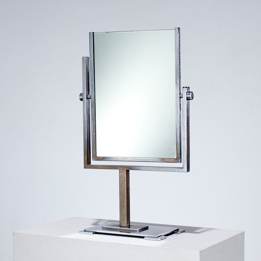 Art Deco double sided chrome vanity mirror: Art Deco double sided chrome vanity mirror, 20th c., on stepped base, unmarked, 25"h x 14"w x 7"d