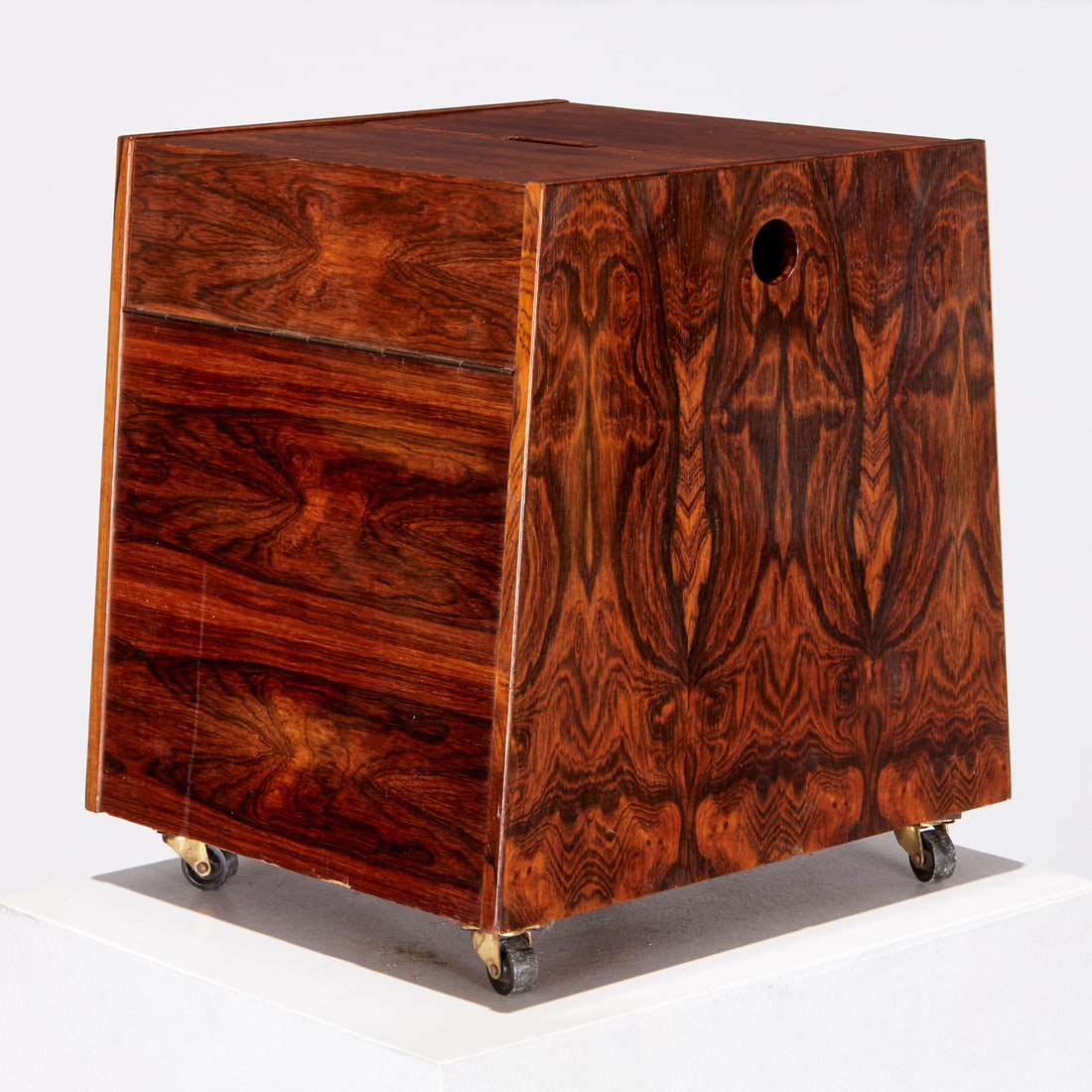 Rolf Hesland, rosewood magazine rack / bar cart: Rolf Hesland, rosewood magazine rack / bar cart, Mid-20th c., hinged top, opens to divided interior with loose shelf, unmarked, 17"h x 13.75"w x 13.25"d