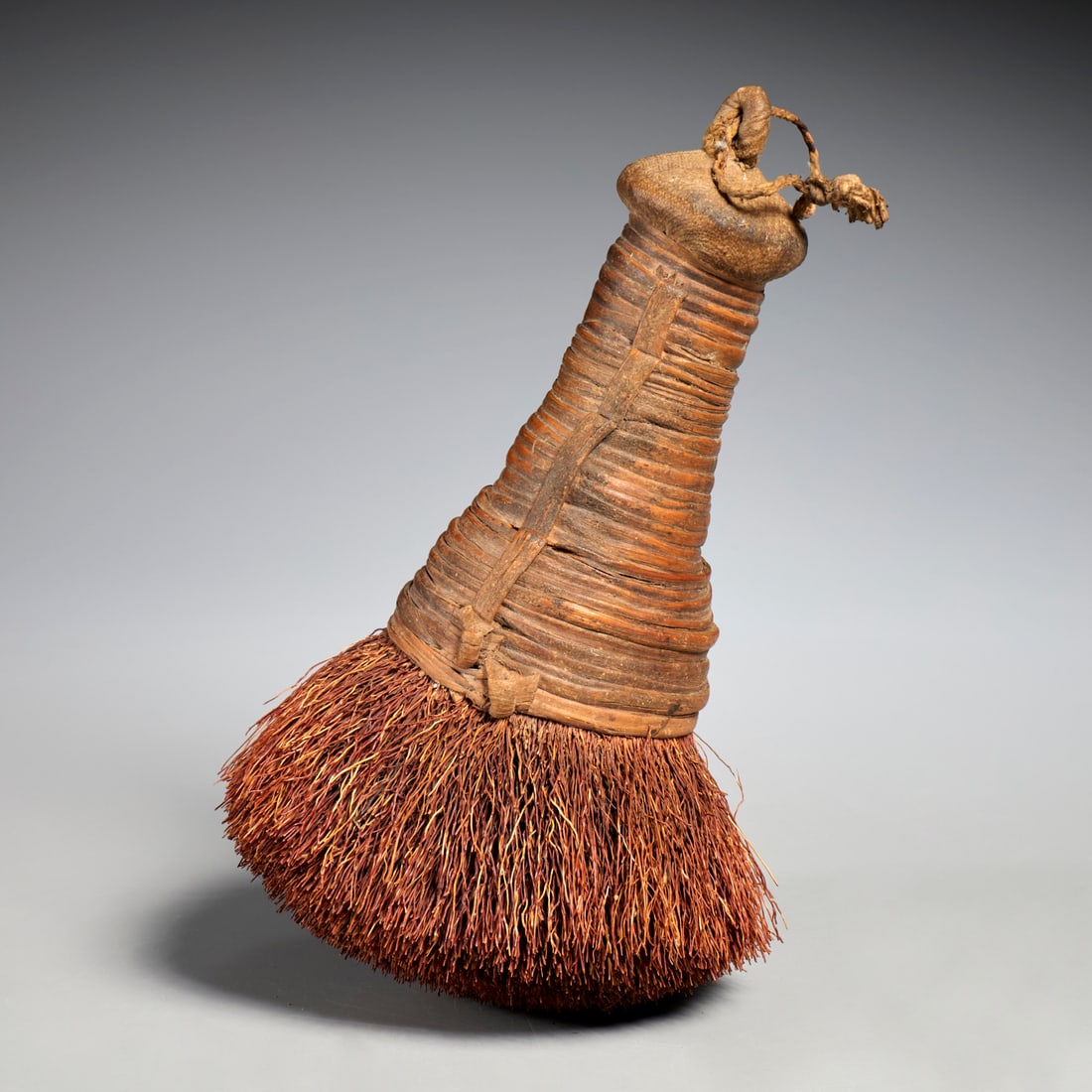 Antique Korean starch brush: Antique Korean starch brush, 20th c., root fibers bound with rattan handle, used for applying starch to delicate fibers for weaving, approx. 9"l x 5"dia
