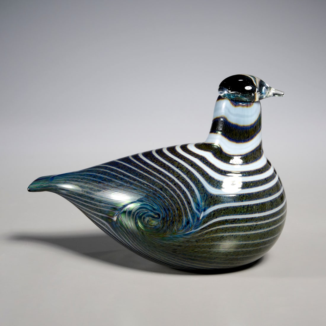 Oiva Toikka for Nuutajarvi Notsjo, glass bird: Oiva Toikka for Nuutajarvi Notsjo, glass bird, 20th c., Finland, striped design in greys, yellows and blues, etched signature underneath, label to side, 5"h x 7"l x 3.75"w