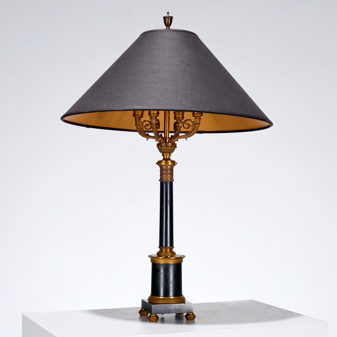 Empire style candelabra table lamp: Empire style candelabra table lamp, 20th c., with "Made in Austria" sticker to underside, 28"h x 4.5"squ (total) Provenance: A Private Collection: 1095 Park Avenue, NYC