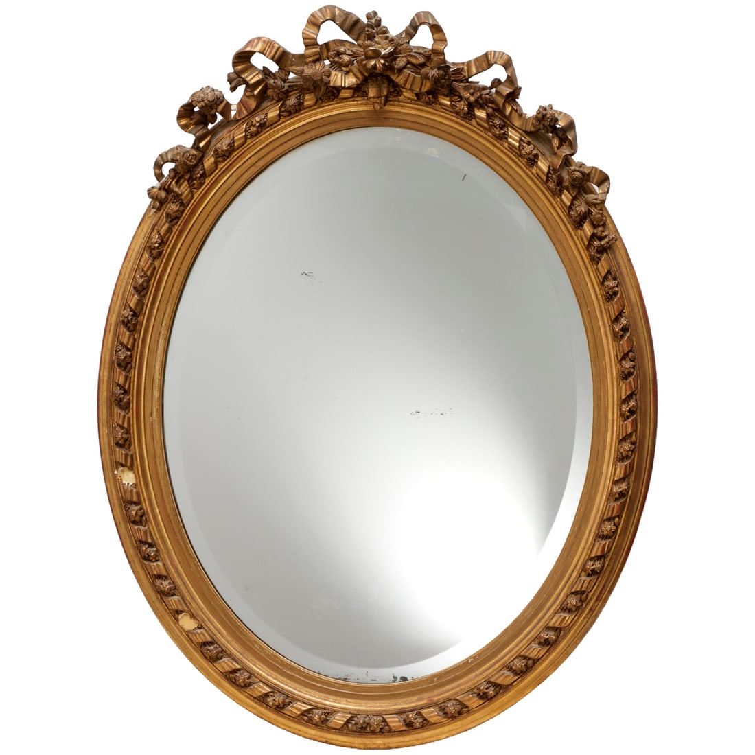 Louis XVI style giltwood and gesso mirror: Louis XVI style giltwood and gesso mirror, 19th/20th c., carved ribbon and floral crest, 43"h x 32.5"w Provenance: A Private Collection: 115 Central Park West, NYC