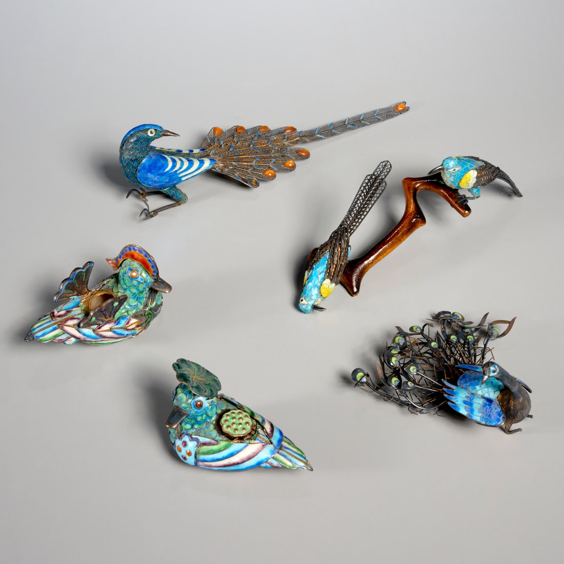 Group (5) Chinese miniature silver enamel birds: Group (5) Chinese miniature silver enamel birds, 20th c., incl. ducks, birds on branch, and peacocks, three examples stamped "925", two with silver content unknown, 2.25"h x 8l x 2.25"w (largest),