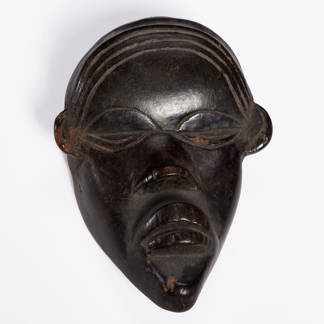 Dan carved wood passport maskette: Dan carved wood passport maskette, 19th/20th c., nice patina, wired for hanging, 5"h x 3.5"w Provenance: The Collection of June and Frank Barsalona, NYC
