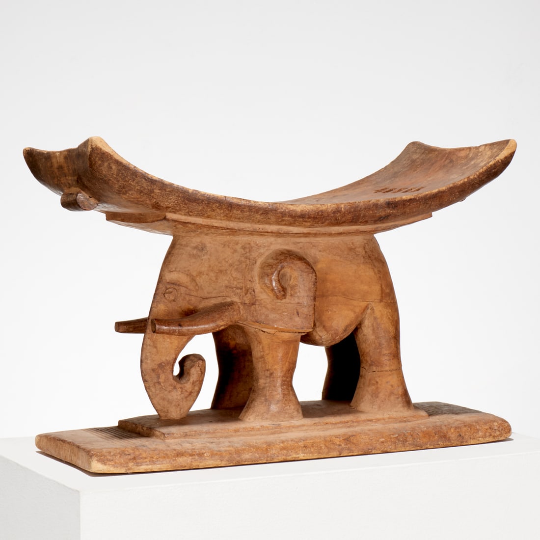 Old Ashanti carved elephant stool: Old Ashanti carved elephant stool, 20th c., Ghana, carved wood, 14"h x 20.75"w x 9.5"d, approx. 12lbs