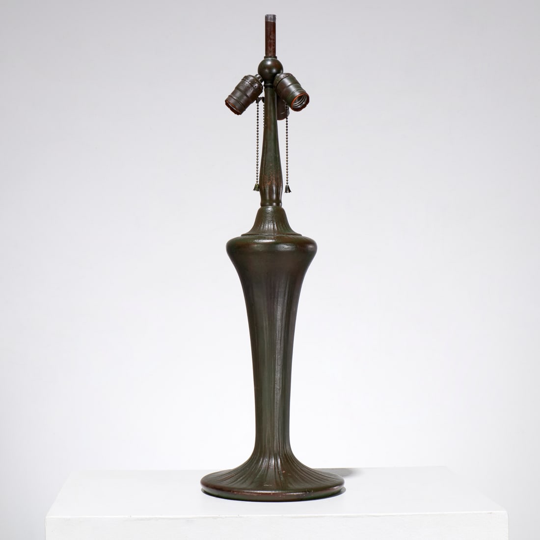 Handel patinated bronze lamp base: Handel patinated bronze lamp base, Early 20th c., three light, stamped "Handel" to underside, 27.5"h x 8.5"dia